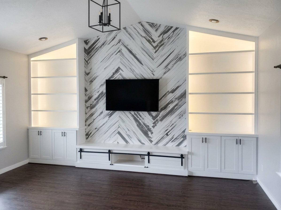 Built-in cabinetry and a patterned accent wall finished in white