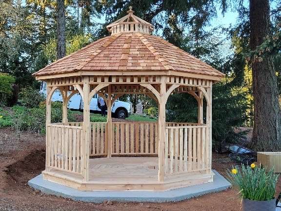 Octagonal cedar gazebo with a shingled roof, newly built